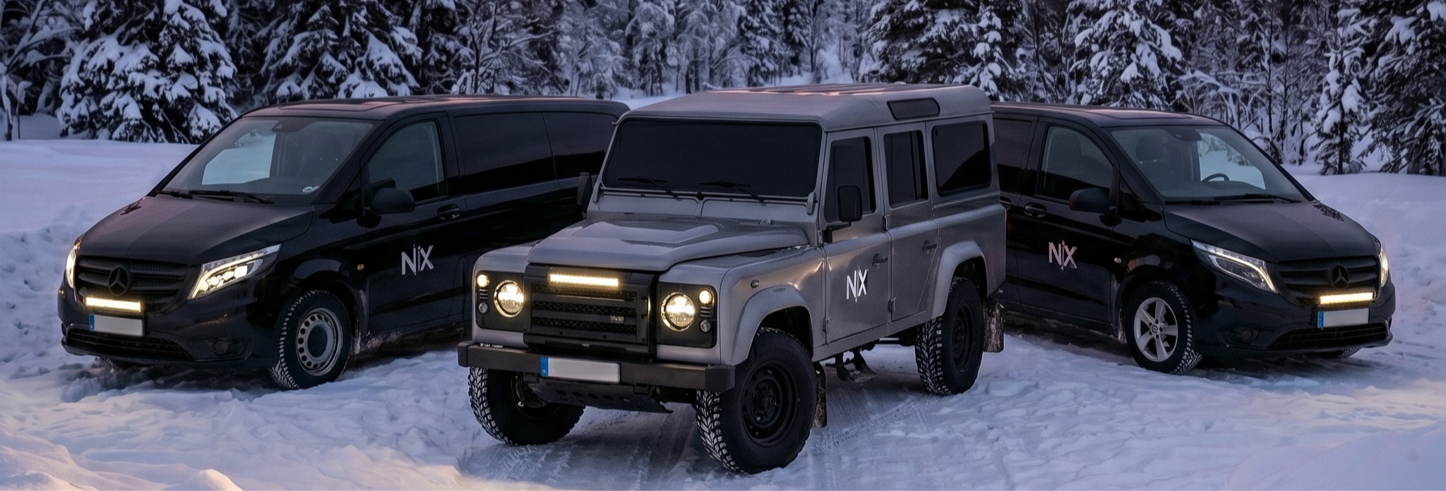 Nordikko vehicles in a snowy forest in Rovaniemi